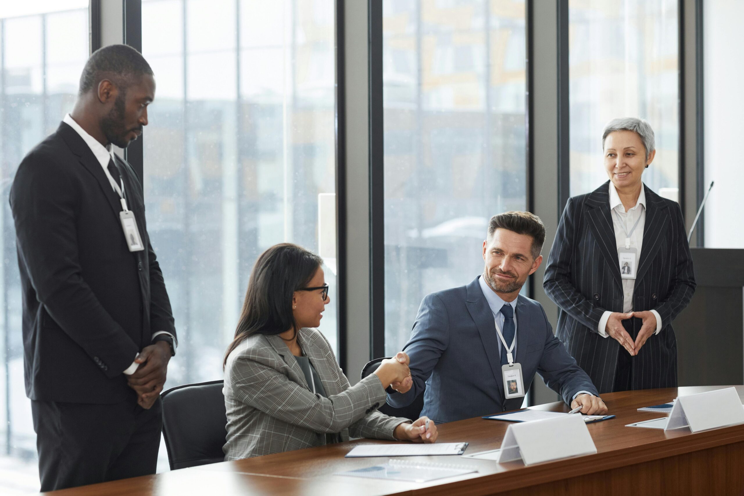Mid-market leadership team collaborating around conference table showcasing partnerships